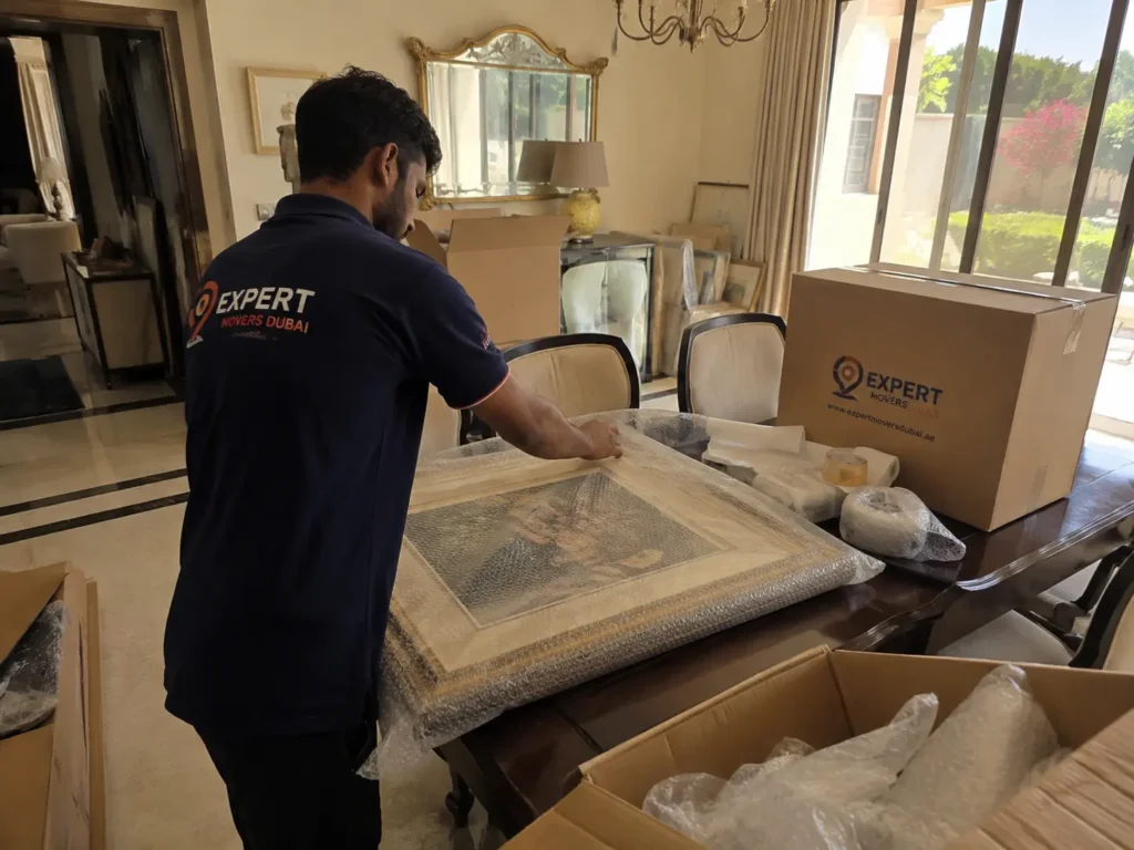 Villa movers Dubai packing fragile items carefully